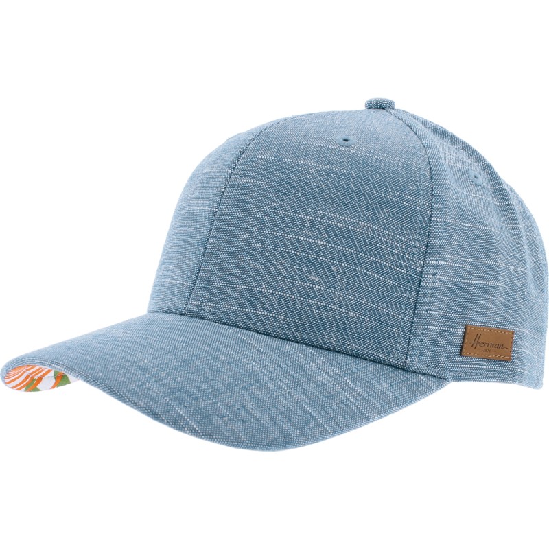 Plain color baseball cap with tropical pattern under the peak. Velcro